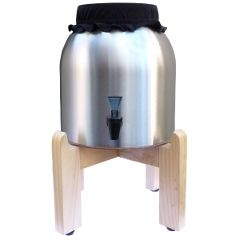 The Kombucha Mamma Stainless Steel Continuous Brew System features a fine-finish wood stand and a 2.5 gallon porcelain brewer